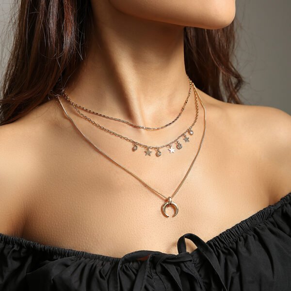 The stars, the crescent moon, the brass chain, the multi-layered necklace